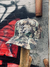 Load image into Gallery viewer, Stuntin - Good Not Great Camo Trucker Hat
